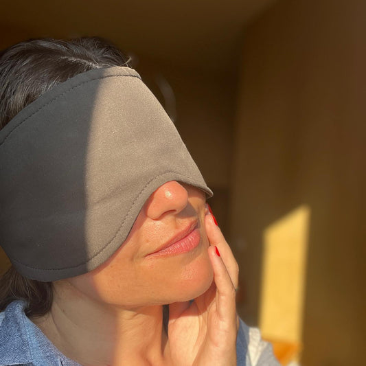woman in eye mask for sleep in the morning sun